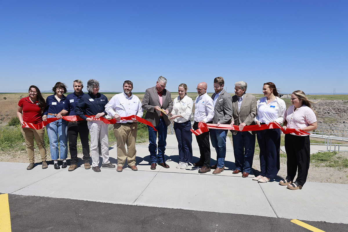 Community members, Bureau of Reclamation employees and state and federal leaders cut the ribbon during the dedication of the new Teton Dam Commemorative Overlook near the former Teton Dam site in eastern Idaho on June 5, 2026. 